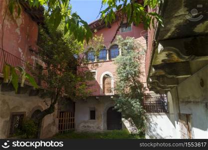 Capo di Ponte, Brescia, Lombardy, Italy:court of old house with plants