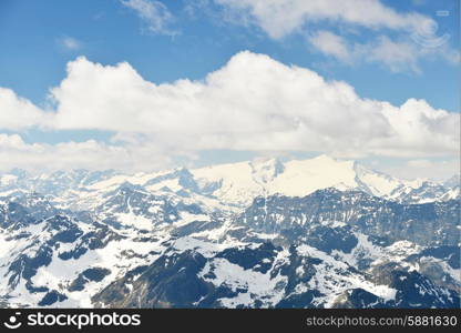 capped mountain peaks and blue sky