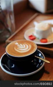 Cappuccino coffee break on wood background