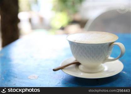 cappuccino coffee in blue vintage