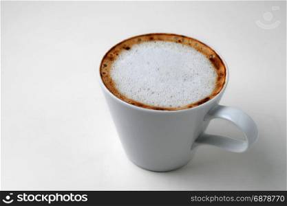 cappuccino coffee in cup isolated on white