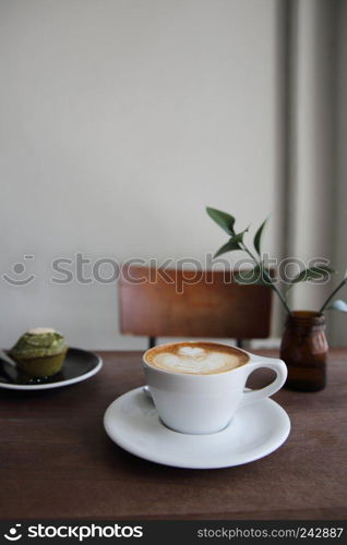 cappuccino coffee on wood background