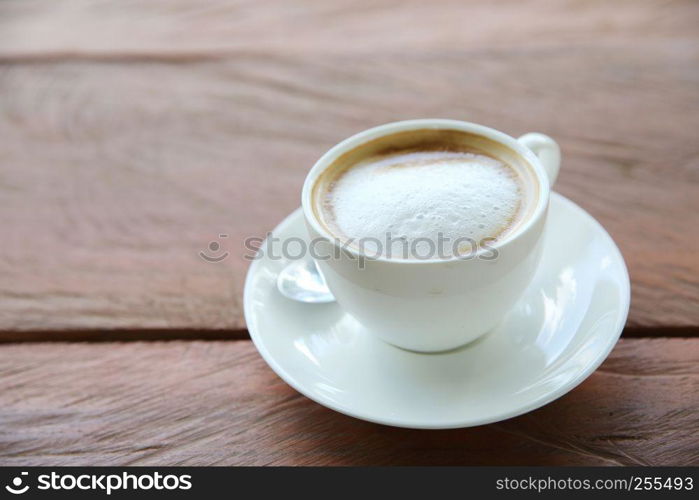 cappuccino coffee on wood background