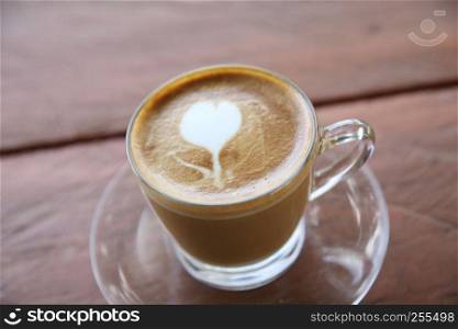 cappuccino coffee on wood background
