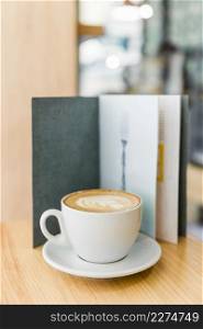 cappuccino coffee with art latte menu wooden table