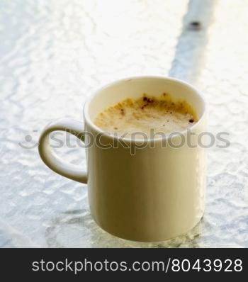 Cappuccino in white cup, outdoor, square image