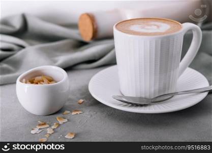 Cappuccino or latte coffee with heart shape and almonds