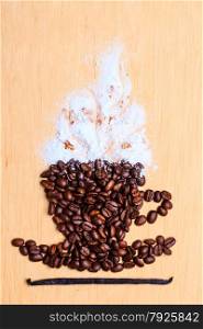 Cappuccino time. Roasted coffee beans placed in shape of cup with white froth vanilla pod on wooden surface background