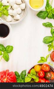 caprese salad ingredients on white wooden background, top view, place for text, italian food frame
