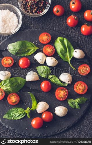 Caprese Salad made of mozzarella, tomatoes, and sweet basil