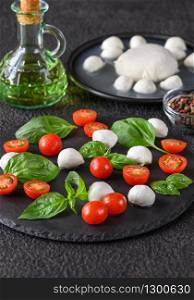 Caprese Salad made of mozzarella, tomatoes, and sweet basil