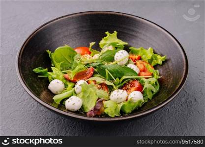 Caprese salad with tomato, mozzarella and basil