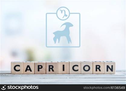 Capricorn star sign on a wooden table