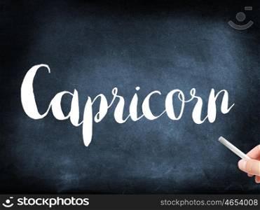 Capricorn written on a blackboard