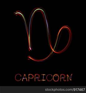 ""Capricorn",Zodiac sign from led light on black background. "