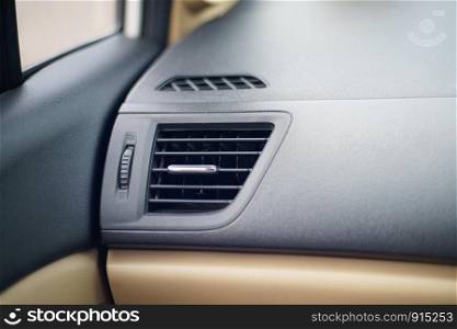 Car air conditioner grid panel on console Close up