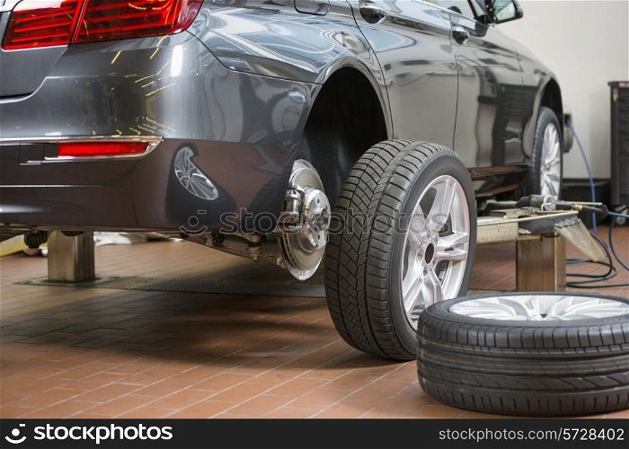Car and tires at repair shop
