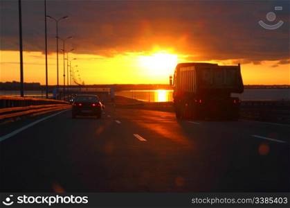 car at sunset highway