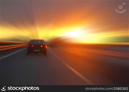car at sunset on the highway