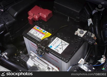 Car battery rechargeable for electrical system of eco car, automotive part concept.
