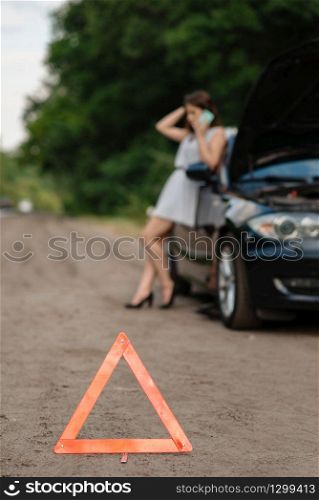 Car breakdown, emergency stop sign, woman calling for help. Broken automobile or problem with vehicle, trouble with punctured auto tire on highway
