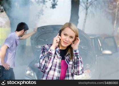 Car breakdown woman call for help road assistance smoking engine