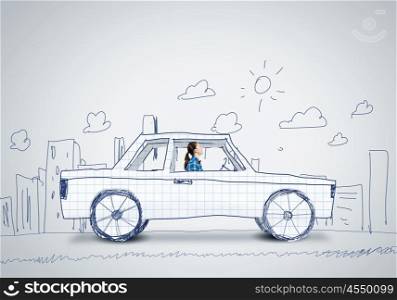 Car concept. Young woman driving car made of paper