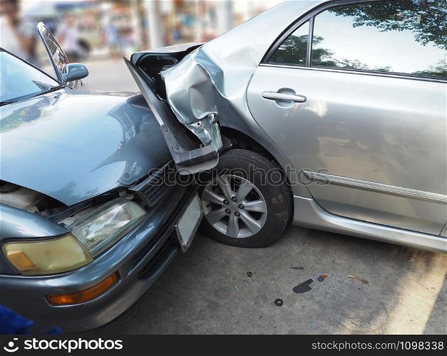 Car crash accident on street with wreck and damaged automobiles. Accident caused by negligence And lack of ability to drive. Due to illness