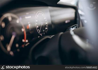 Car dashboard and wheel close up