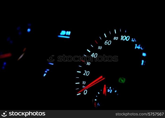 Car dashboard with speedometer, glow in the dark