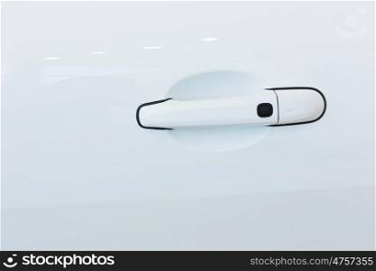 Car door handle. Close up image of white car door handle