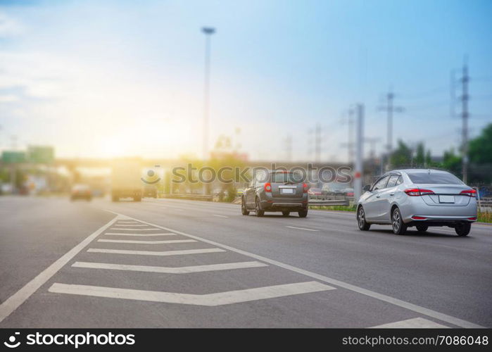 Car Driving on High Way Road And Blue Sky Background