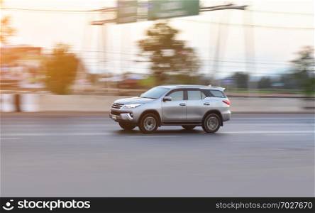 Car driving on road and Small passenger car seat on the road used for daily trips