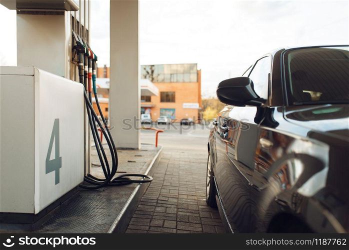 Car fueling on gas station, fuel refill, nobody. Petrol, gasoline or diesel refuel service, petroleum refueling. Car fueling on gas station, fuel refill, nobody