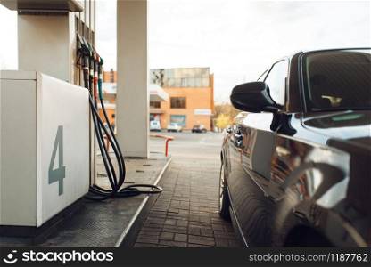 Car fueling on gas station, fuel refill, nobody. Petrol, gasoline or diesel refuel service, petroleum refueling. Car fueling on gas station, fuel refill, nobody