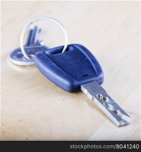 Car key over wooden background, square image