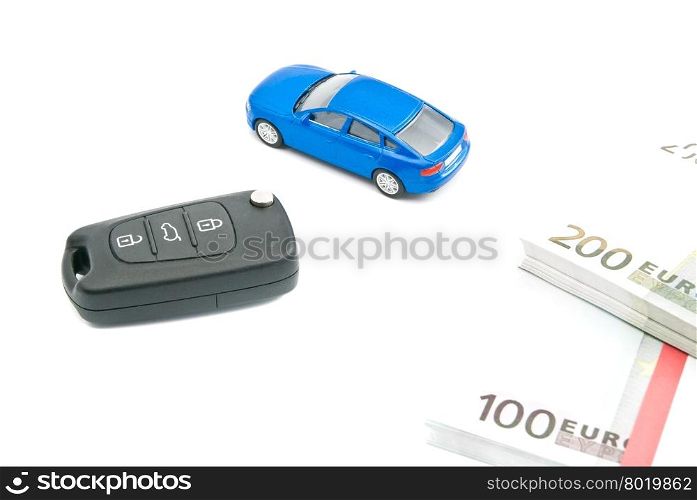 car keys, blue car and euro notes on white