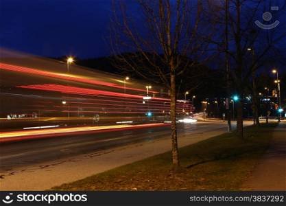 Car lights at night, long exposure photo of traffic