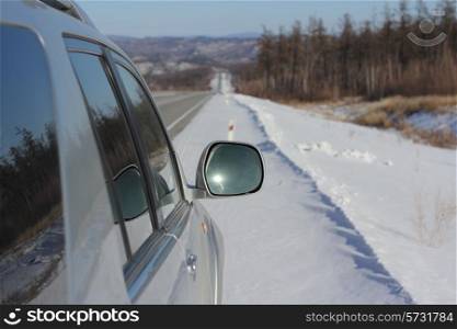 Car on winter road.