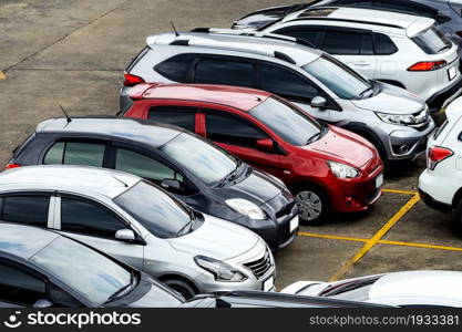 Car parked at parking lot of the airport for rental. Aerial view of Eco car parking lot of airport. Used luxury SUV car for sale and rental service. Automobile parking space. Car dealership concept.