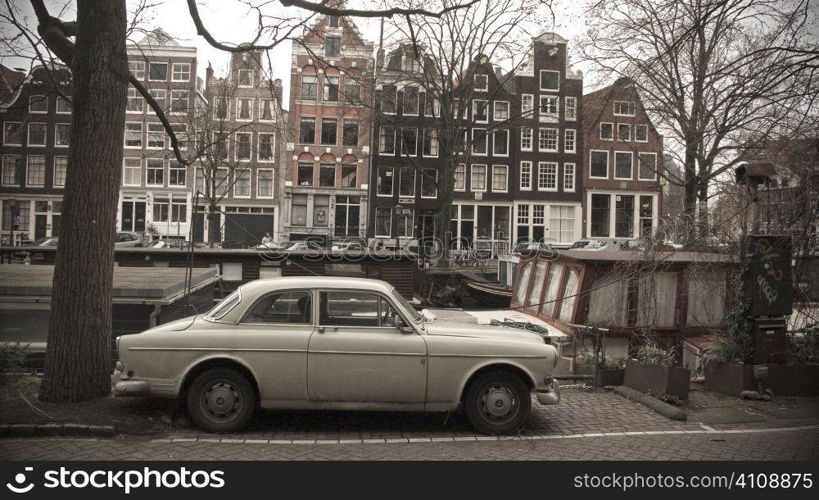 Car parked by canal in winter