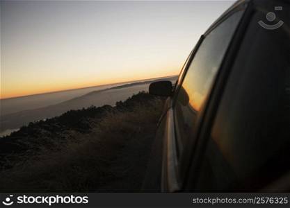 Car parked on a hill at dusk