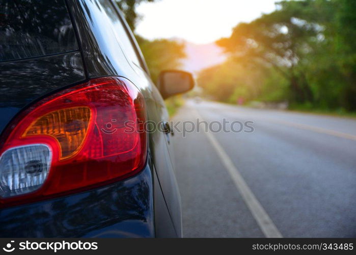 Car parked on road and Small passenger car seat on the road used for daily trips