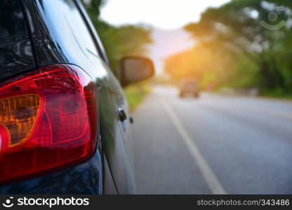 Car parked on road and Small passenger car seat on the road used for daily trips