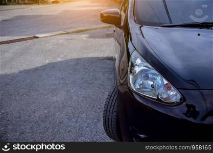 Car parked on street,Car on road and sunset background,Tire of car on road