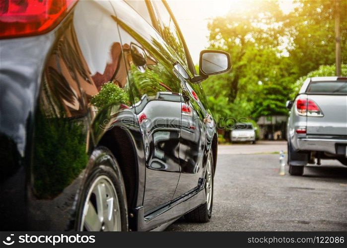 Car parked on street sunlight background
