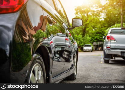 Car parked on street sunlight background