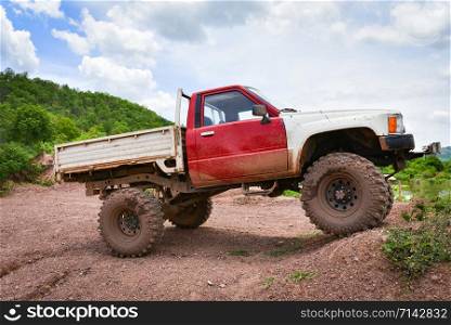 Car pickup truck 4X4 Offroad trekking travel in the countryside road dirt