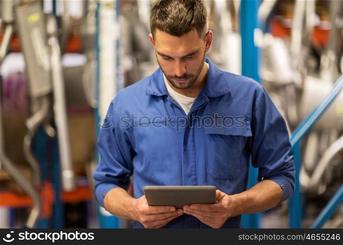 car service, repair, maintenance and people concept - auto mechanic man or smith with tablet pc computer at workshop or warehouse