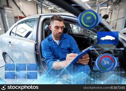 car service, repair, maintenance and people concept - auto mechanic man or smith with clipboard writing at workshop. auto mechanic man with clipboard at car workshop
